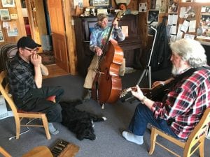 A band named for what they call the most delicious bit of a salmon, Bellymeat is comprised of Gary Gouker on the harmonica, Ernie Eggleston on base and Ted Howard on the mandolin. (KCAW photo / Enrique Pérez de la Rosa)