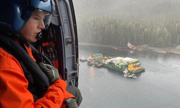 Tugboat towing container barge runs aground in Neva Strait