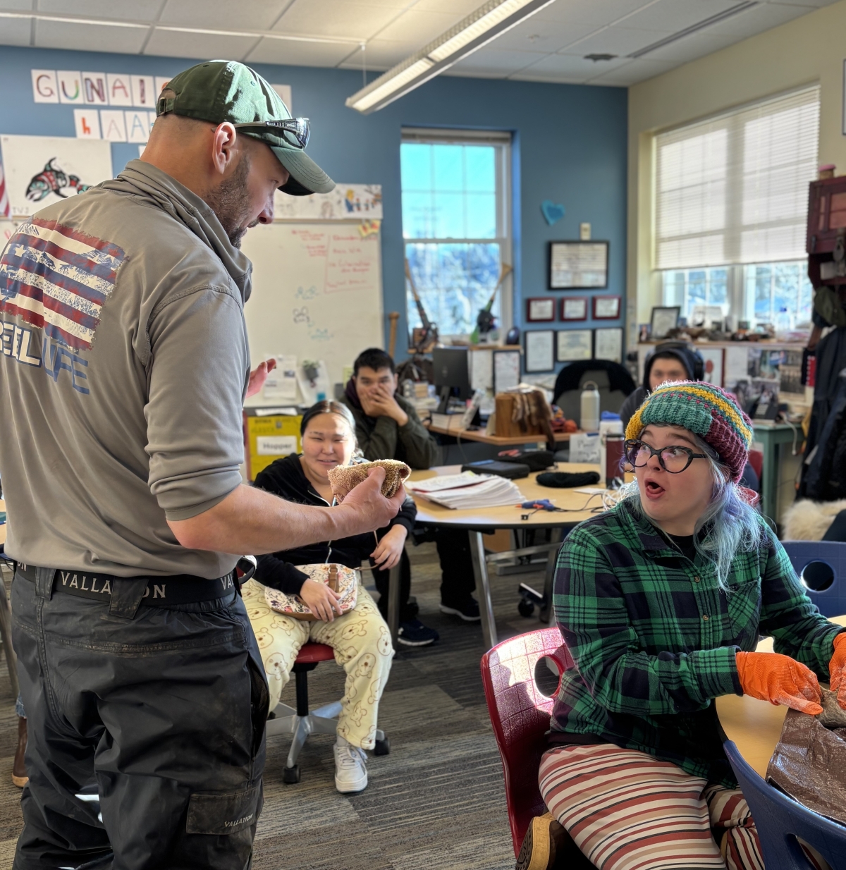 Jud Kirkness shows Pacific High School students a pouch made from deer stomach