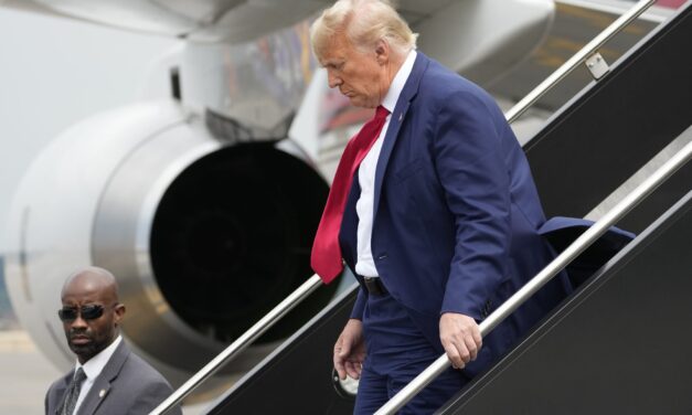 Trump heads to Iowa hoping to refocus attention from shootings to the economy