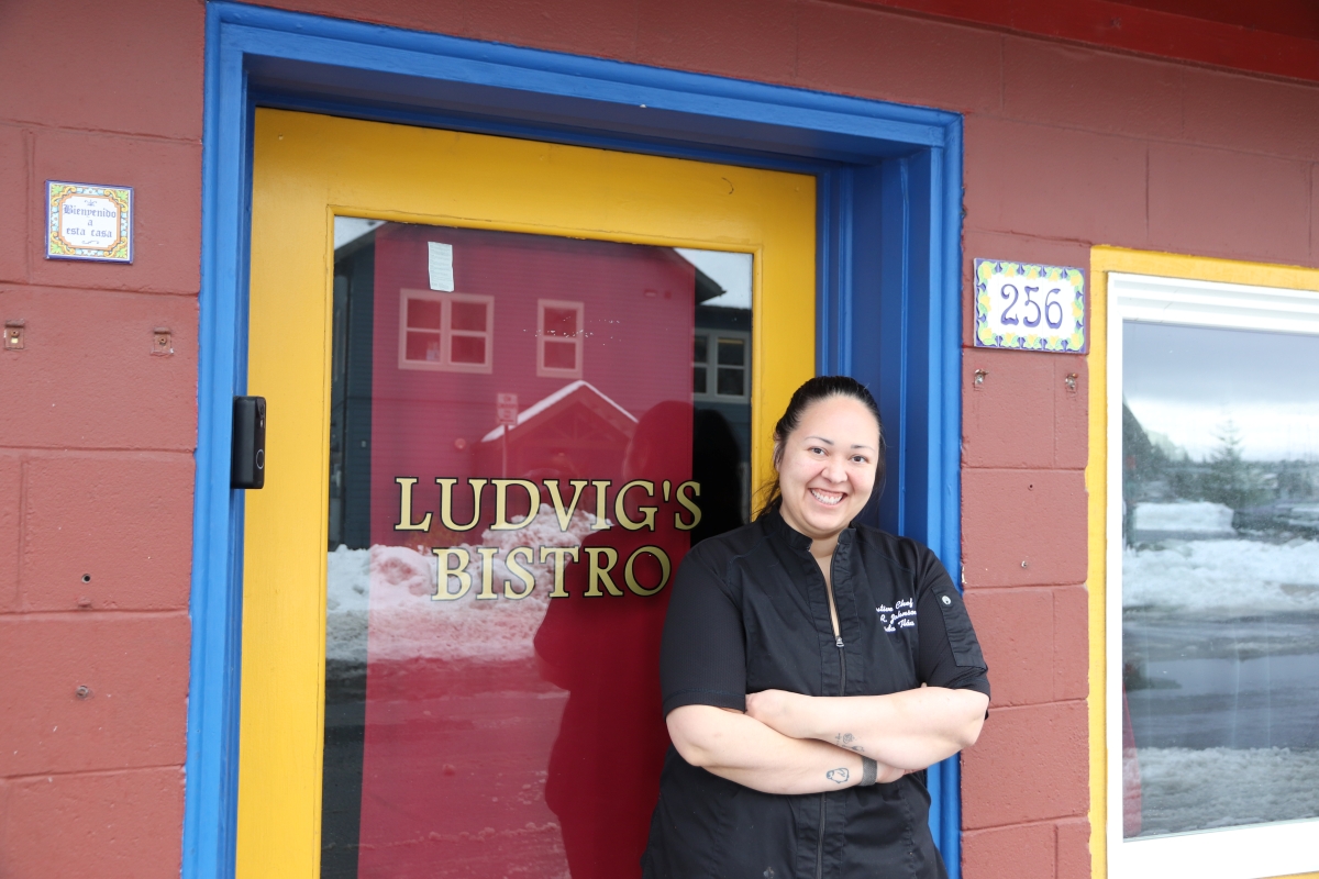 Chef Edith Johnson poses in front of her restaurant Ludvig's Bistro (KCAW/Cotter)