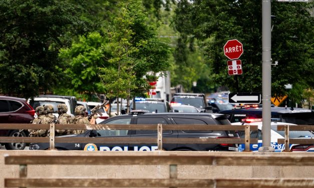 Gunman kills an officer at a Montreal hotel before being shot dead, police say